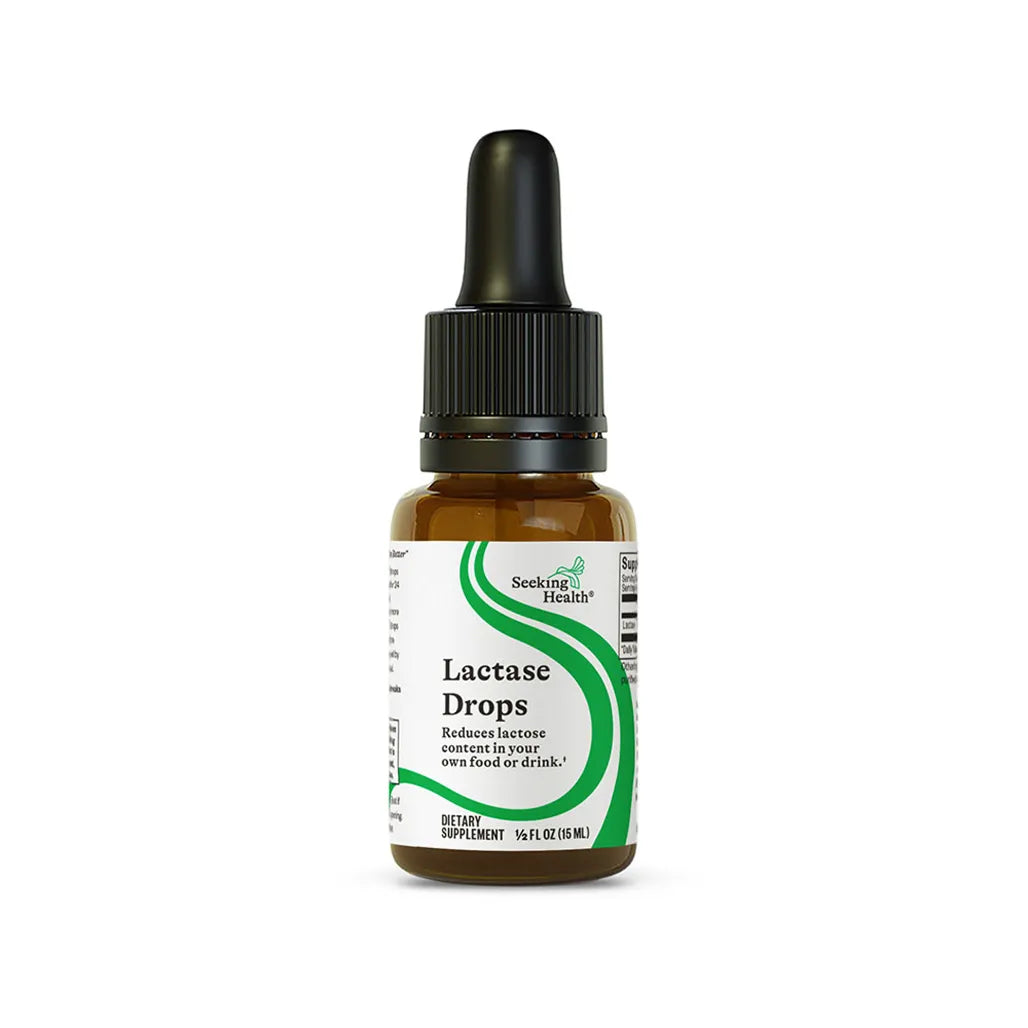 Seeking Health Lactase Drops dietary supplement bottle helps reduce lactose content in food and drinks, 15 ml size.